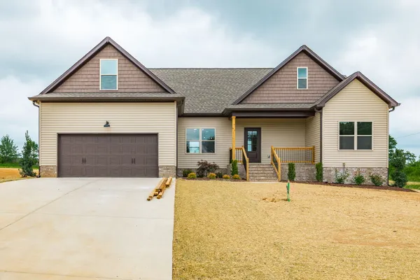 Front exterior of 1200 Vickie Ln, a new-construction home with a two-car garage on a 1-acre lot in Portland TN