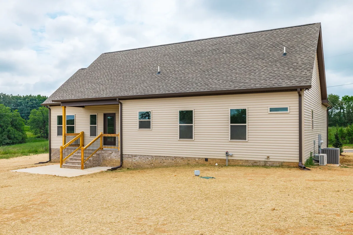 Rear exterior with a covered patio at 1200 Vickie Ln