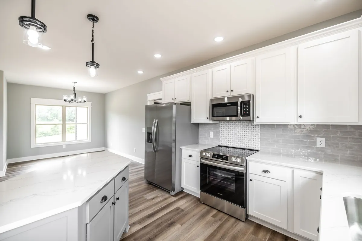 Open kitchen with island and pendant lighting at 1200 Vickie Ln