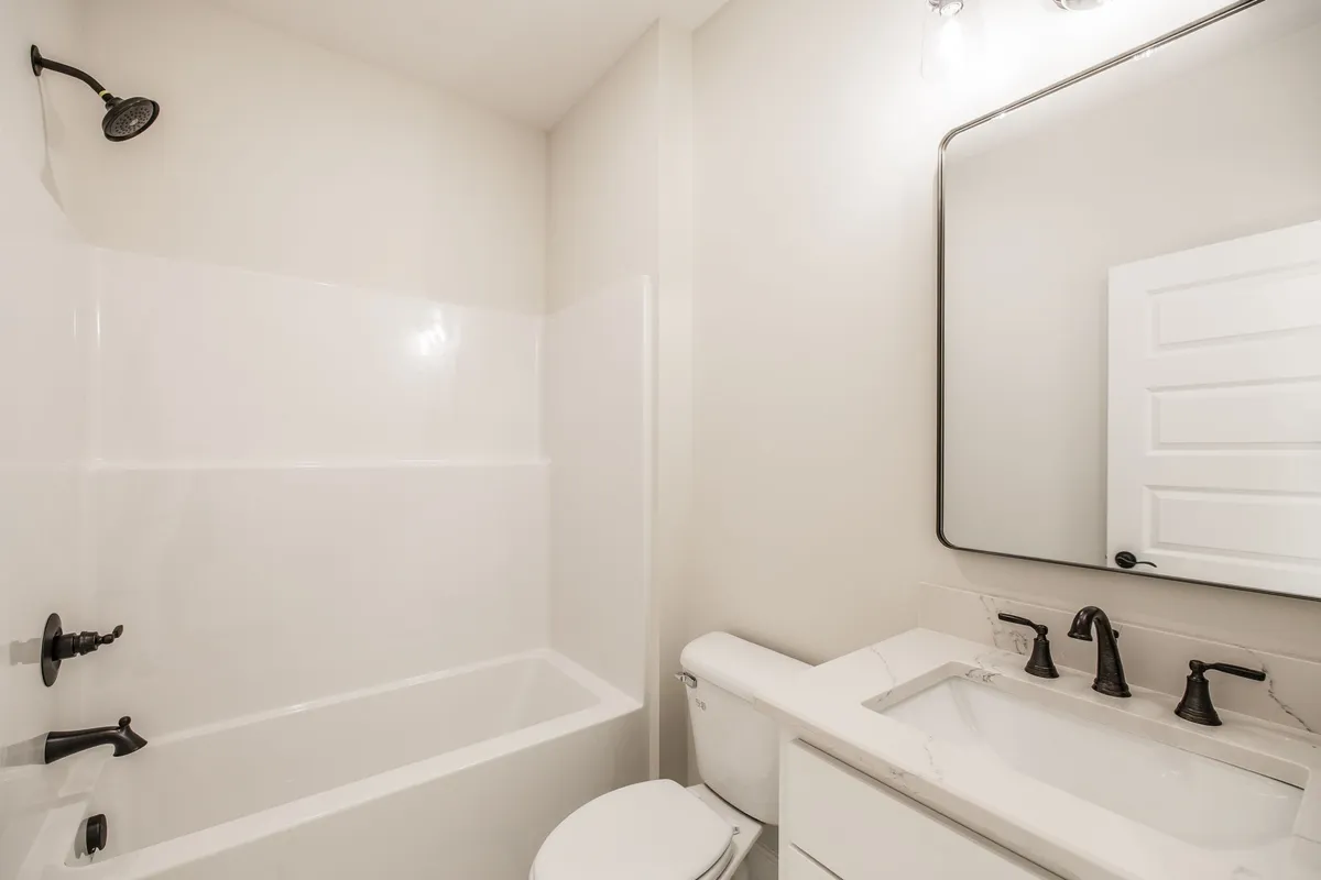 Second full bathroom with a tub-shower combo and vanity at 1204 Vickie Ln