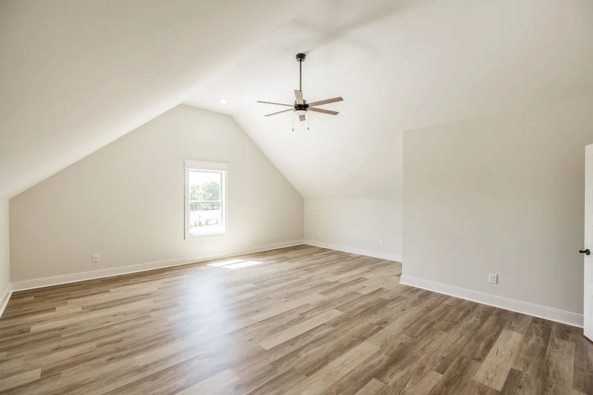 20-by-20 bonus room over the garage with a vaulted ceiling at 1204 Vickie Ln