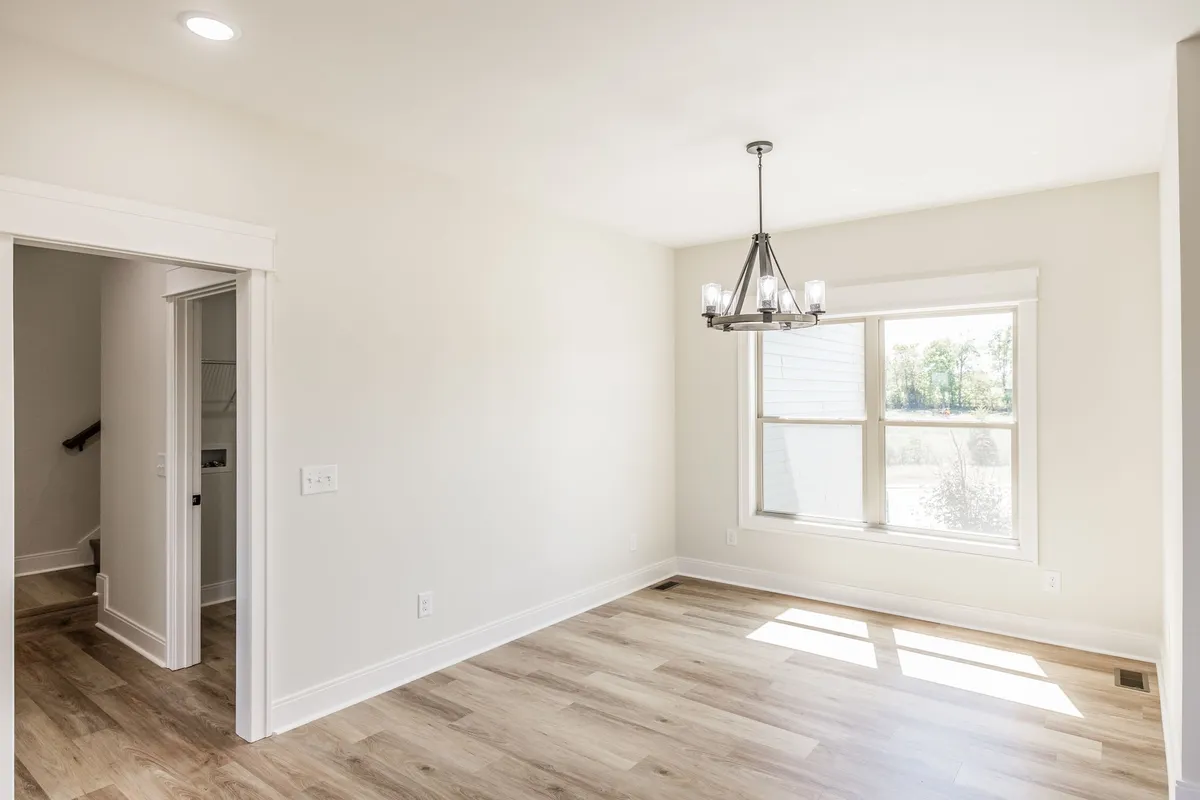 Dining area with chandelier and natural light at 1204 Vickie Ln