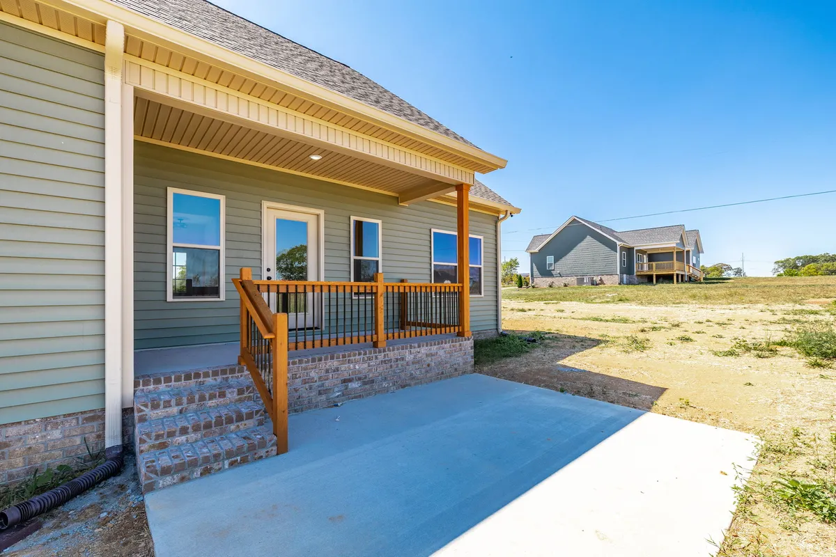 Rear exterior with a covered patio overlooking the back yard at 1204 Vickie Ln