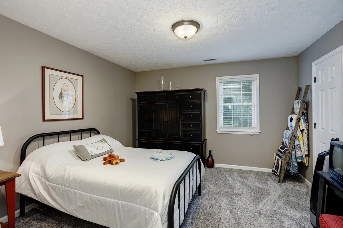 Third bedroom with natural light and updated carpet at 129 Baldridge Dr