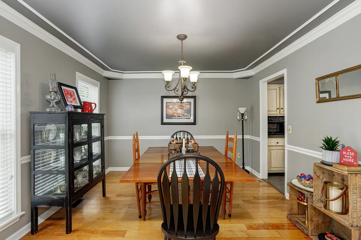 Formal dining room with hardwood floors and a chandelier at 129 Baldridge Dr