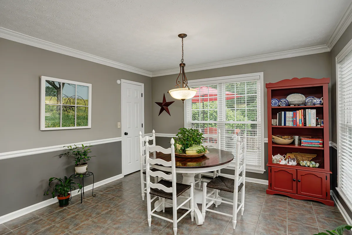 Eat-in breakfast area off the kitchen with windows over the backyard at 129 Baldridge Dr