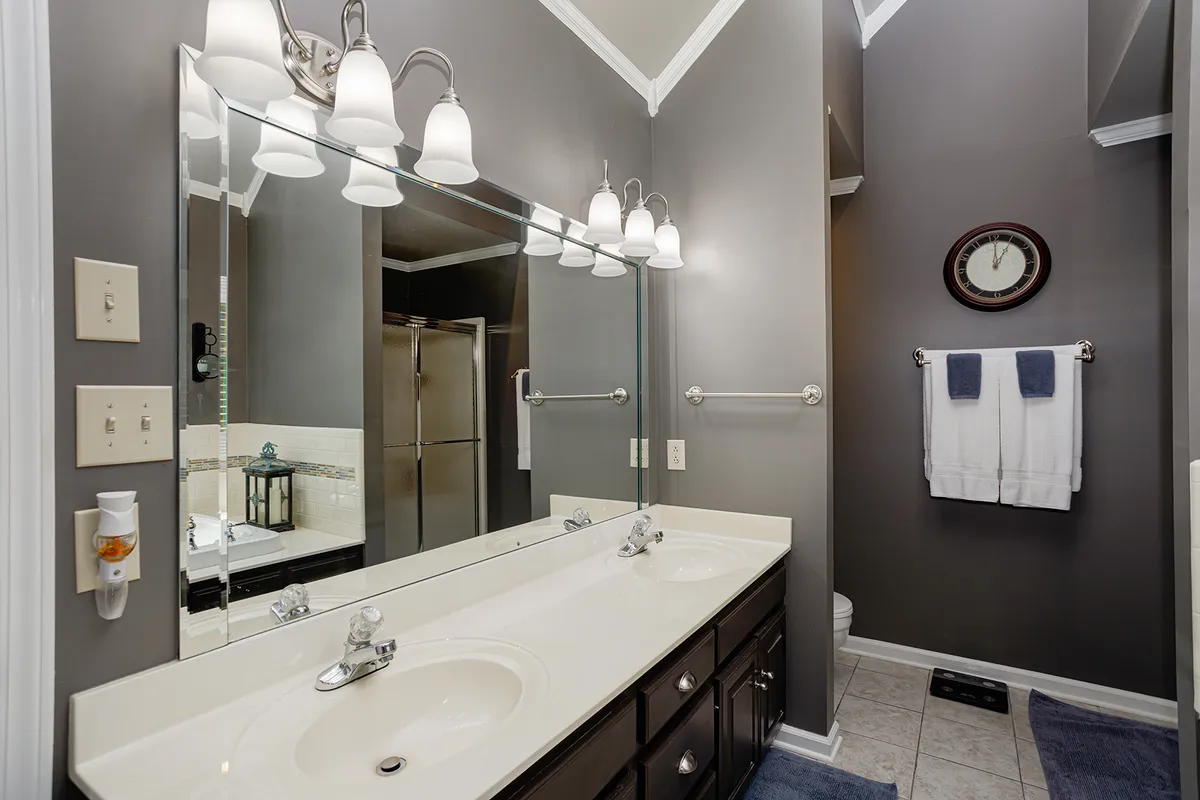 Primary bathroom with a double vanity and separate tub and shower at 129 Baldridge Dr