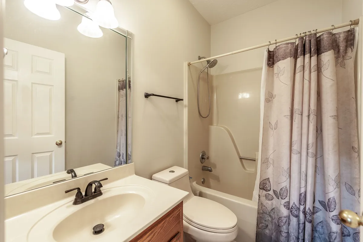 Second full bathroom with a vanity and tub-shower at 6513 N Mount Pleasant Rd