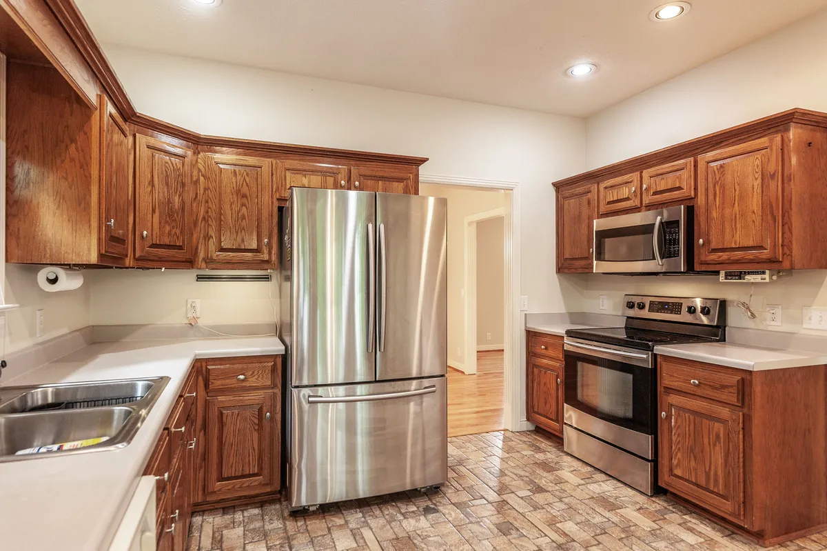 Kitchen with a stainless range and breakfast area at 6513 N Mount Pleasant Rd
