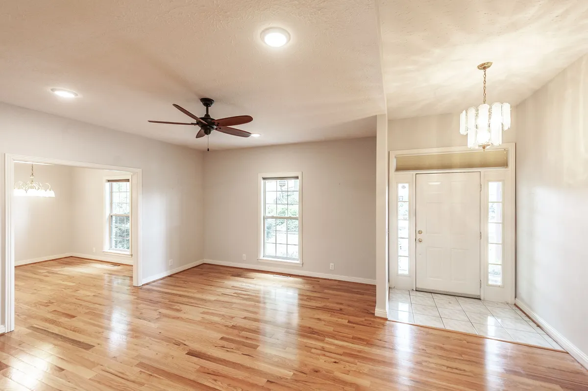 Open living area with vaulted ceiling and hardwood floors at 6513 N Mount Pleasant Rd
