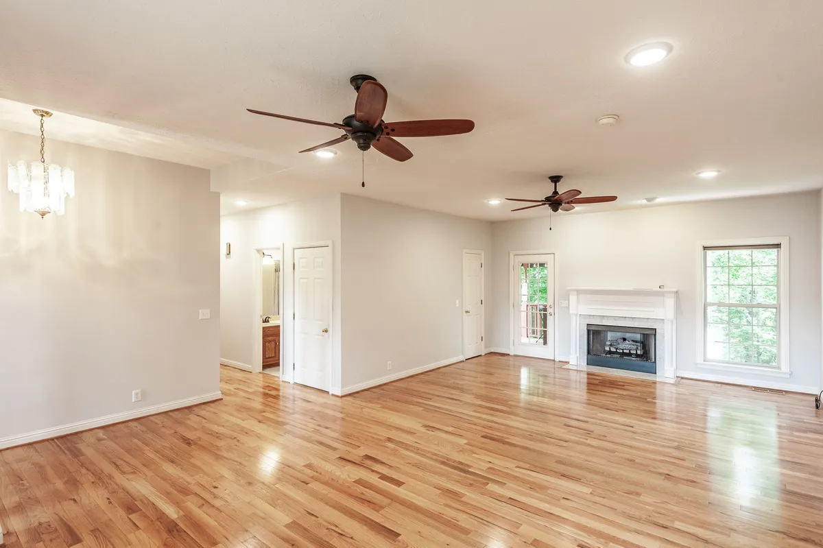 Living room with a fireplace and hardwood floors at 6513 N Mount Pleasant Rd